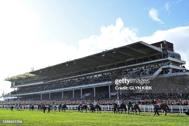 Horses are paraded ahead of the Cheltenham Gold Cup Chase race on the final day of the Cheltenham Festival at Cheltenham Racecourse, in Cheltenham,...