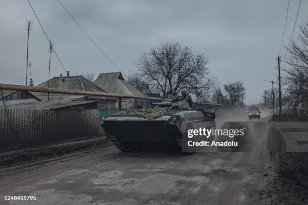 Ukrainian tank passes by a street in Chasiv Yar, Ukraine on March 17, 2023.