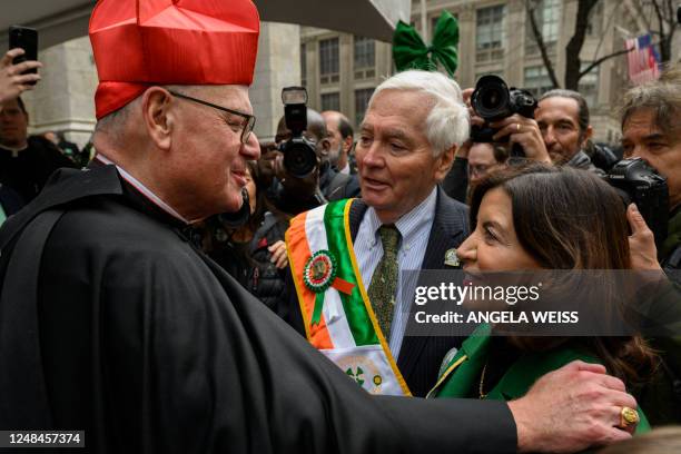 Cardinal Timothy Dolan, Archbishop of New York, greets New York State Governor Kathy Hochul during the St. Patrick's Day parade in New York City on...