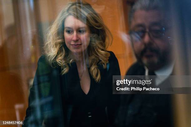 Former Theranos CEO Elizabeth Holmes moves through security while on her way to court on March 17, 2023 in San Jose, California. Holmes is appearing...