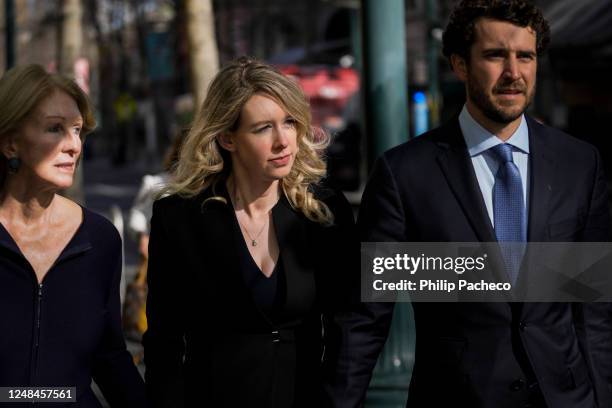 Former Theranos CEO Elizabeth Holmes , alongside her mother Noel Holmes and boyfriend Billy Evans , makes her way to court on March 17, 2023 in San...
