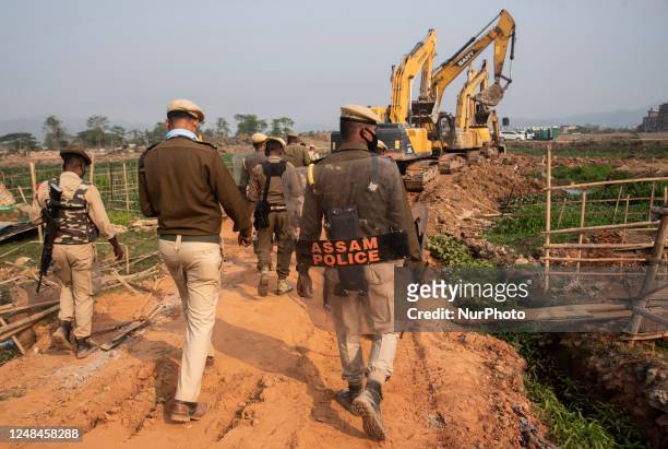 Assam police personnel during an anti-encroachment eviction drive by Guwahati Metropolitan Development Authority, on February 27, 2023 in Guwahati,...