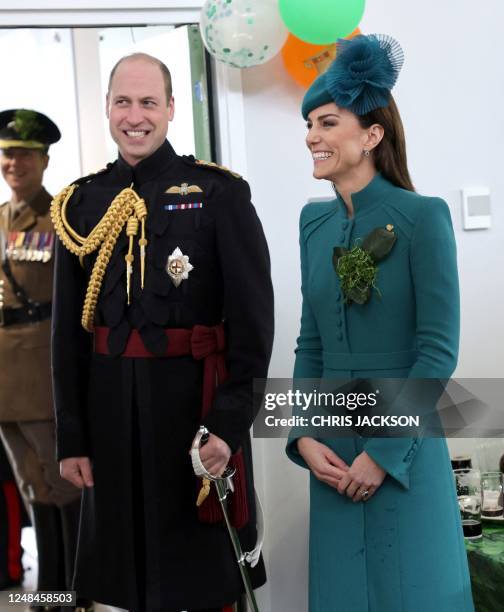 Britain's Prince William, Prince of Wales and Britain's Catherine, Princess of Wales meet with members of the 1st Battalion Irish Guards following...