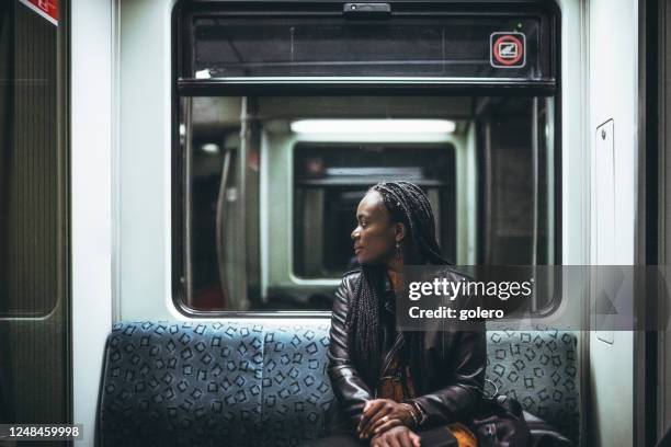 in the metro train - comboio de metropolitano imagens e fotografias de stock