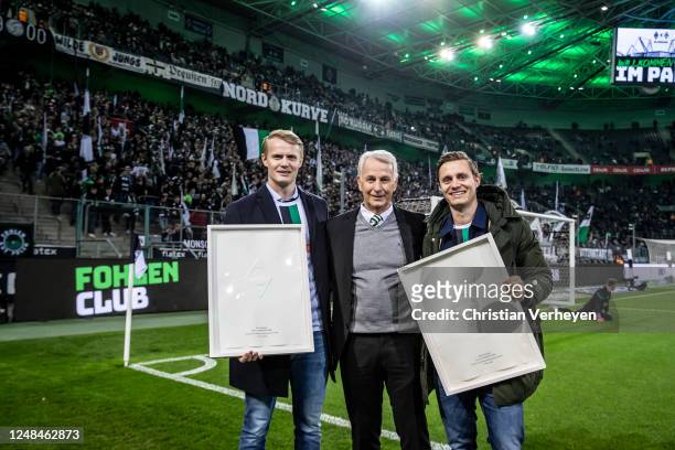 Mats and Tom Grambusch are honored by Rainer Bonhof ahead of the Bundesliga match between Borussia Moenchengladbach and SV Werder Bremen at...