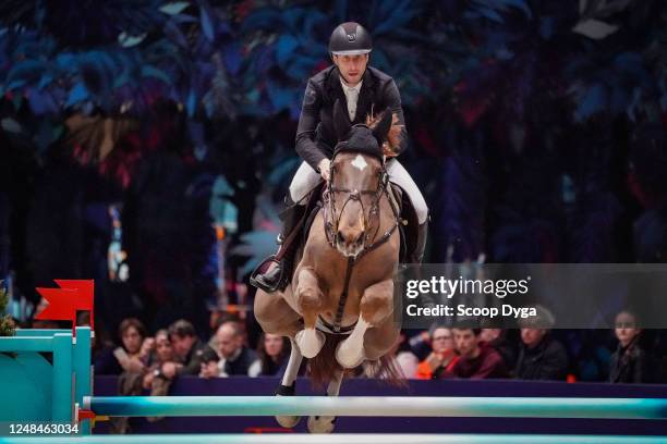 Pieter Devos riding Mom's Toupie de la Roque during the Hermes Grand Prix on March 17, 2023 in Paris, France.