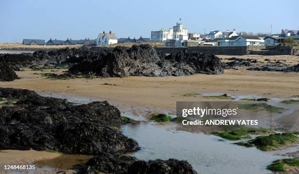 Houses overlook the beach near the RAF Valley in Anglesey on March 25, 2011. The island of Anglesey has about as many sheep as people, but it is...