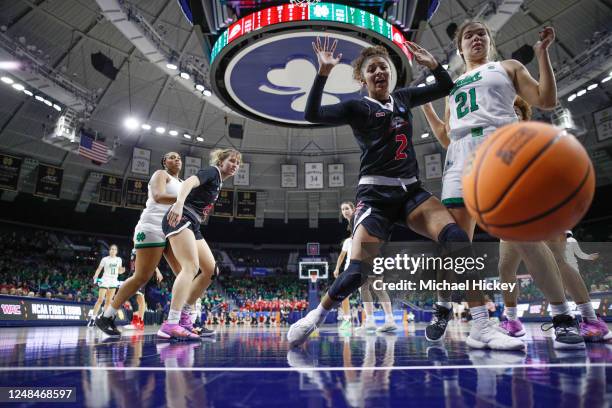 Tomekia Whitman of the Southern Utah Thunderbirds and Maddy Westbeld of the Notre Dame Fighting Irish react to a ball that is going out of bounds...