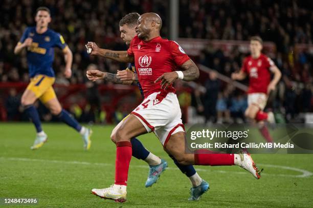 Andre Ayew of Nottingham Forest and Kieran Trippier of Newcastle United in action during the Premier League match between Nottingham Forest and...