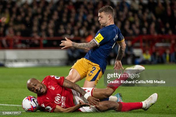 Andre Ayew of Nottingham Forest brought down by Kieran Trippier of Newcastle United during the Premier League match between Nottingham Forest and...