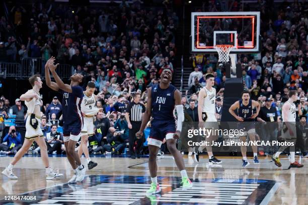 Players from the Fairleigh Dickinson Knights celebrate their win over the Purdue Boilermakers in the first round of the 2023 NCAA Men's Basketball...