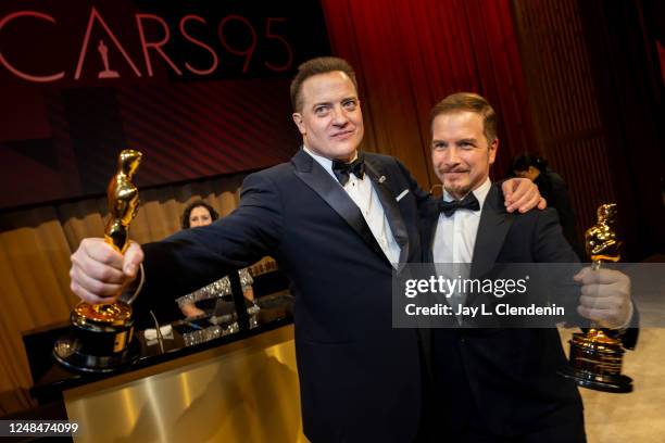 Brendan Fraser, winner of Best Actor in a Leading Role, and Adrien Morot, winner of Best Makeup and Hairstyling, both for "The Whale," at the trophy...
