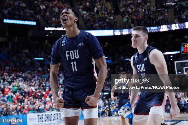 Sean Moore of the Fairleigh Dickinson Knights celebrates after making a basket against the Purdue Boilermakers in the first round of the 2023 NCAA...