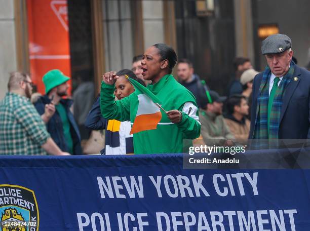 The first female commissioner of the New York Police Department Keechant Sewell is seen with the Irish flag during the annual St. Patrick's Day...