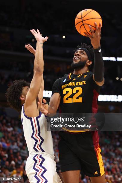 Warren Washington of the Arizona State Sun Devils drives to the basket against Micah Peavy of the TCU Horned Frogs during the first round of the 2023...