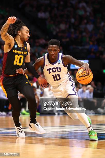 Damion Baugh of the TCU Horned Frogs drives to the basket against Frankie Collins of the Arizona State Sun Devils during the first round of the 2023...