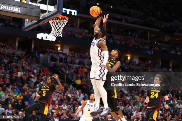 Mike Miles Jr. #1 of the TCU Horned Frogs drives to the basket against Alonzo Gaffney of the Arizona State Sun Devils during the first round of the...