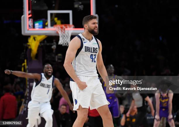 Maxi Kleber of the Dallas Mavericks celebrates after scoring the buzz beating winning there-point basket against Anthony Davis of the Los Angeles...