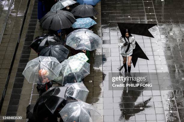 Model displays a creation from the docomo × RequaL? 2023 A/W collection by designer Tetsuya Doi at the Tokyo Fashion Week in Tokyo on March 18, 2023.