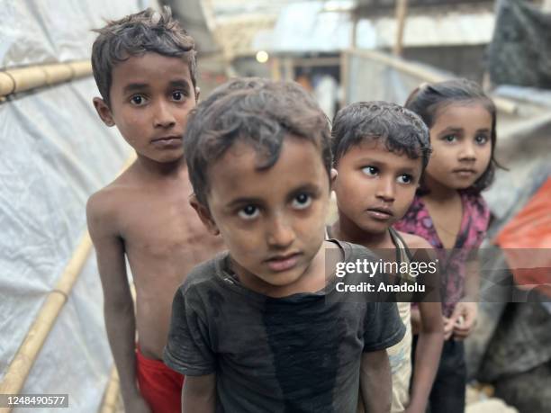 Rohingya children were playing as the persecuted people were rebuilding tents with bamboo and tarpaulin sheets at the refugee camp no. 11 in the...