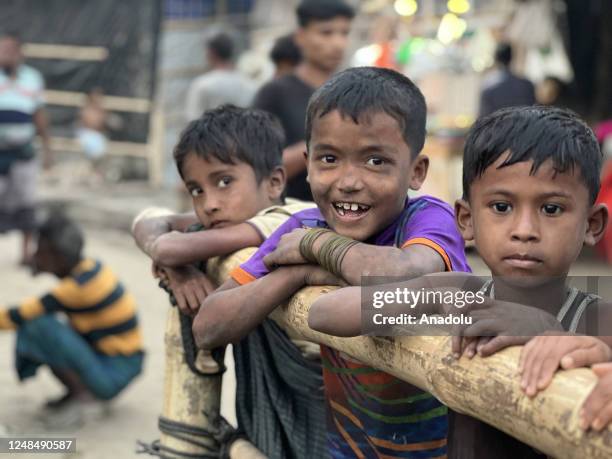 Rohingya boys were smiling during playing as the persecuted people were rebuilding tents with bamboo and tarpaulin sheets at the refugee camp no. 11...