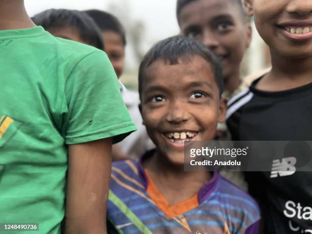 Rohingya boys were smiling during playing as the persecuted people were rebuilding tents with bamboo and tarpaulin sheets at the refugee camp no. 11...