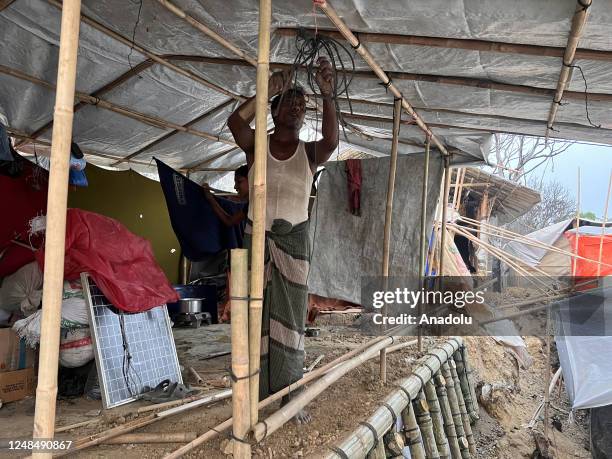 Persecuted Rohingya were rebuilding tents with bamboo and tarpaulin sheets at the refugee camp no. 11 in the southern border district of COXâS Bazar,...