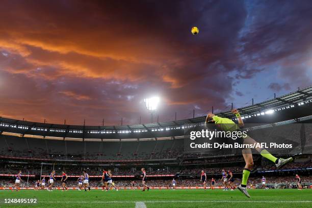 The boundary umpire throws the ball in during the 2023 AFL Round 01 match between the Melbourne Demons and the Western Bulldogs at the Melbourne...