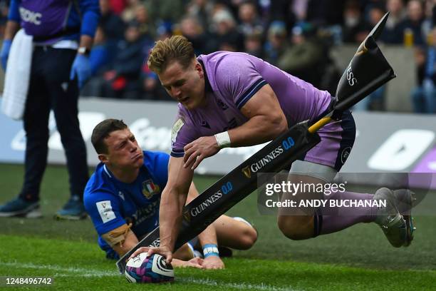 Scotland's wing Duhan van der Merwe scores their first try during the Six Nations international rugby union match between Scotland and Italy at...