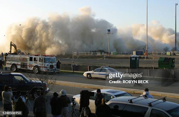 The US Airways Arena in Landover, Maryland collapses as the building is destroyed to make way for a shopping center, 15 December 2002. The venue,...