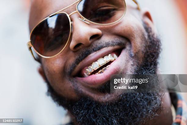 african-american man with gold grill - capped tooth imagens e fotografias de stock