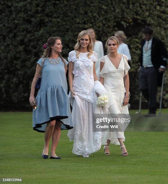 Chloe Delevingne, Poppy Delevingne and Cara Delevingne are seen at Poppy Delevingne wedding on May 16, 2014 in London, England.