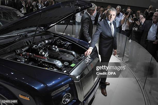 Of Rolls-Royce carmaker Torsten Müller-tvös and British humorist Rowan Atkinson aka Mr. Bean present a car at the international car show IAA in...