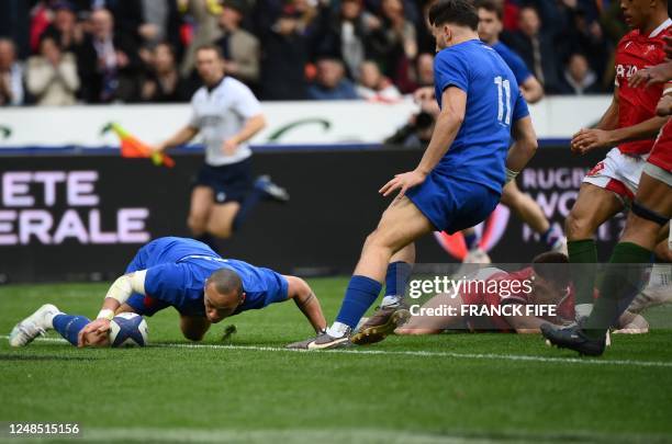 France's centre Gael Fickou scores the team's fourth try during the Six Nations rugby union international match between France and Wales at Stade de...