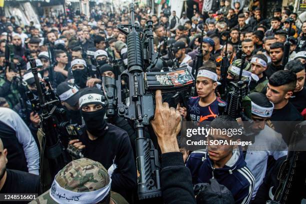 Palestinian gunmen from the Al-Aqsa Martyrs Brigades of the Fatah movement led by President Mahmoud Abbas seen carrying their weapons during the...