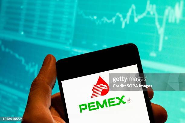 In this photo illustration, the Mexican oil and gas company Petróleos Mexicanos, better known as the Pemex logo is seen displayed on a smartphone...