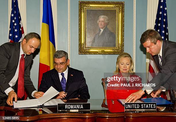 Romanian Foreign Minister Teodor Basconschi and US Secretary of State Hillary Clinton sign a Ballistic Missile Defense Agreement between the US and...