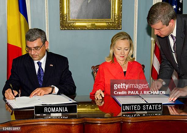 Romanian Foreign Minister Teodor Basconschi and US Secretary of State Hillary Clinton sign a Ballistic Missile Defense Agreement between the US and...