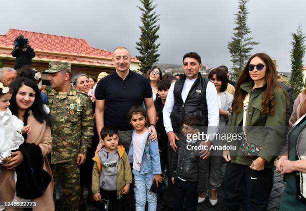 Azerbaijani President Ilham Aliyev , his wife Mihriban Aliyeva and their daughter Arzu Aliyeva meet with the people live in the village after...