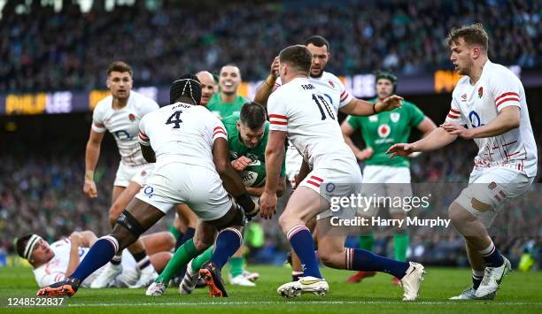 Dublin , Ireland - 18 March 2023; Jonathan Sexton of Ireland is stopped short of the tryline by Maro Itoje and Owen Farrell of England during the...