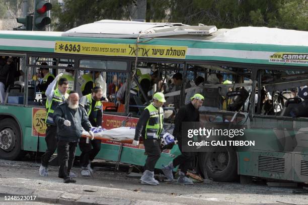 Body is evacuate by Ultra Orthodox volunteers from the bus after a Palestinian suicide attack on an Israeli bus in the center of Jerusalem 22...