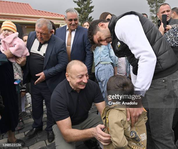 Azerbaijani President Ilham Aliyev , his wife Mihriban Aliyeva and their daughter Arzu Aliyeva meet with the people live in the village after...