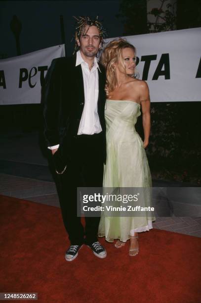 American rock drummer Tommy Lee and Canadian actress Pamela Anderson attend the 1999 PETA Humanitarian Awards, held at Paramount Studios in Los...