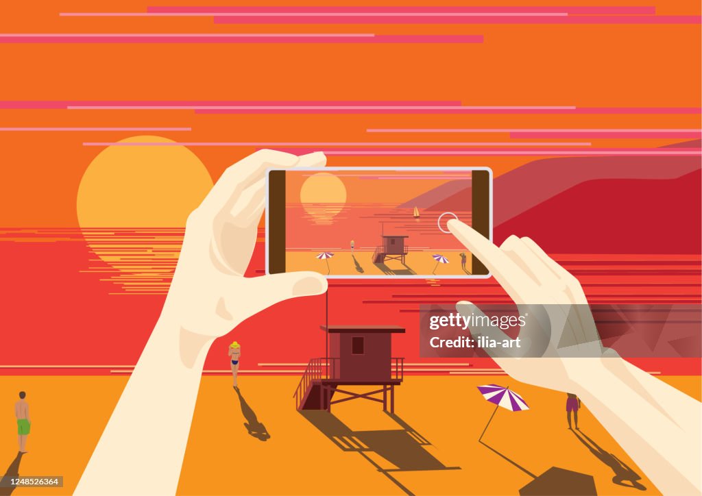 Someone is photographing a sunset on the west coast.