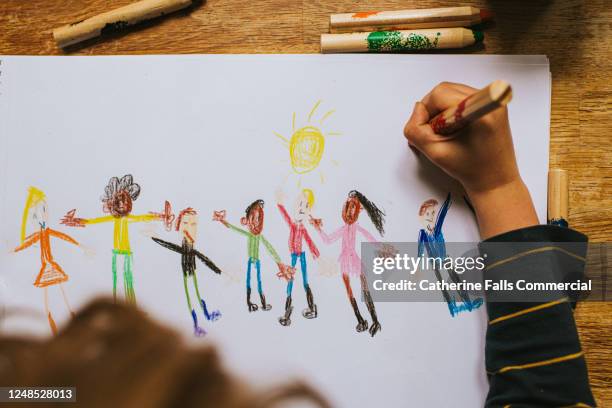 child drawing figures - showing empathy stock pictures, royalty-free photos & images