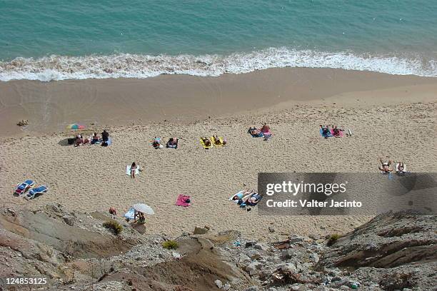 blue beach and rock - burgau portugal stock pictures, royalty-free photos & images