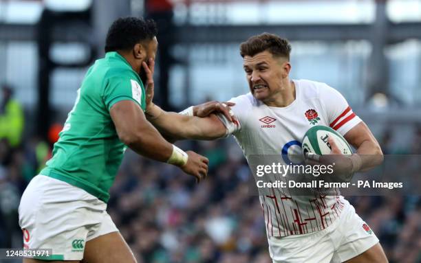 England's Henry Slade is tackled by Ireland's Bundee Aki during the Guinness Six Nations match at Aviva Stadium, Dublin. Picture date: Saturday March...