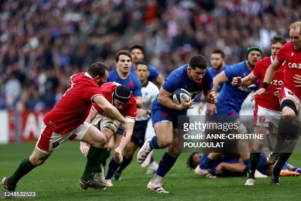 France's hooker Julien Marchand runs with the ball during the Six Nations rugby union international match between France and Wales at Stade de...