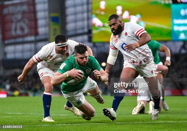 Dublin , Ireland - 18 March 2023; Robbie Henshaw of Ireland dives over to score his side's second try during the Guinness Six Nations Rugby...