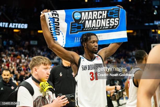 Nathan Mensah of the San Diego State Aztecs celebrates after beating the Furman Paladins during the second round of the 2023 NCAA Men's Basketball...